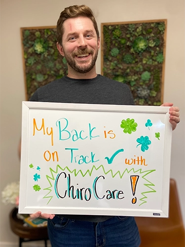 Chiropractic Walnut Creek CA Patient Holding Sign With Testimonial