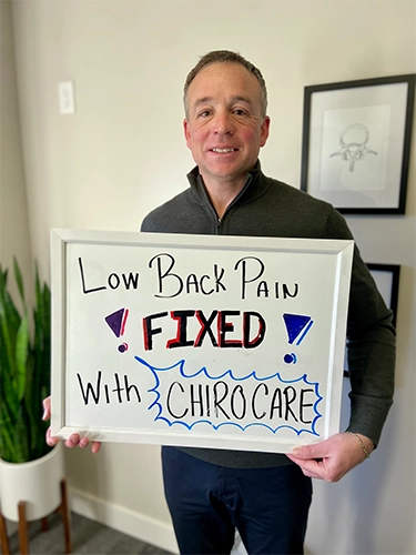 Chiropractic Walnut Creek CA Patient Holding Sign With Testimonial