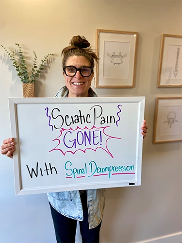 Chiropractic Walnut Creek CA Patient Holding Sign With Testimonial