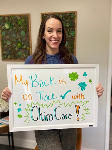 Chiropractic Walnut Creek CA Patient Holding Sign With Testimonial