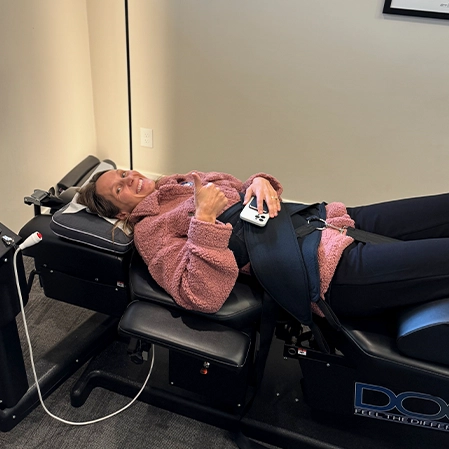 Chiropractic Walnut Creek CA Woman In Decompression Machine