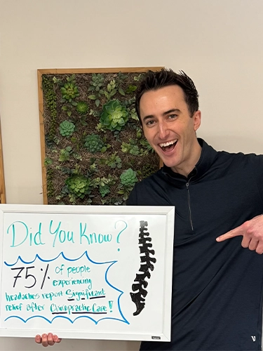 Chiropractor Walnut Creek CA Jason Walsh Holding Sign